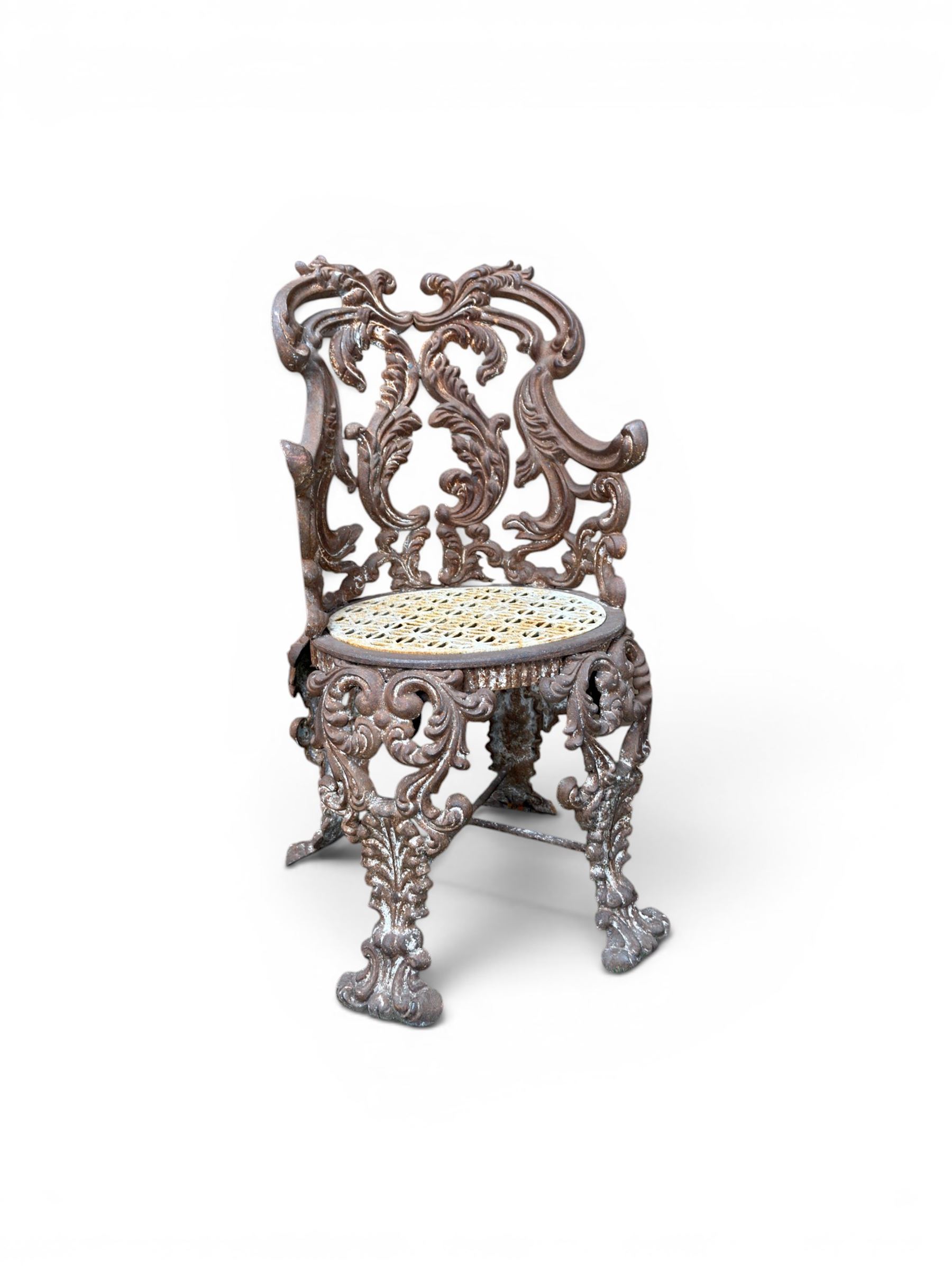 19th century Rococo Revival cast iron garden chair, pierced back comprised of scrolling acanthus leaves, over a pierced geometric white painted drop-in seat, raised on four acanthus and anthemion shaped cabriole supports united by X-frame stretcher