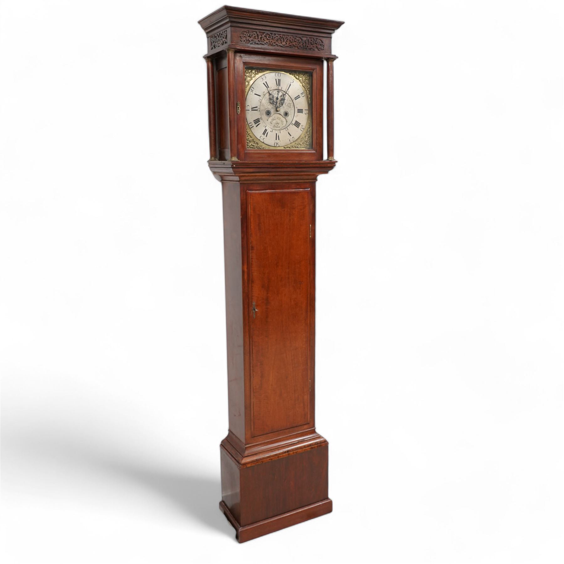 Mahogany - 8-day longcase clock, with a flat pediment and blind fret frieze beneath, square hood door with detached freestanding pilasters, trunk with a flat topped door on a short plinth with applied skirting,  square brass dial with cast spandrels and a silvered chapter with Roman numerals and five-minute Arabic's, engraved dial centre with seconds dial and silvered cartouche inscribed 