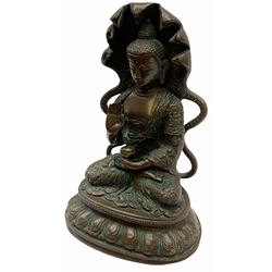 Brass figure of a deity, possibly Tibetan, seated in the lotus position H19cm