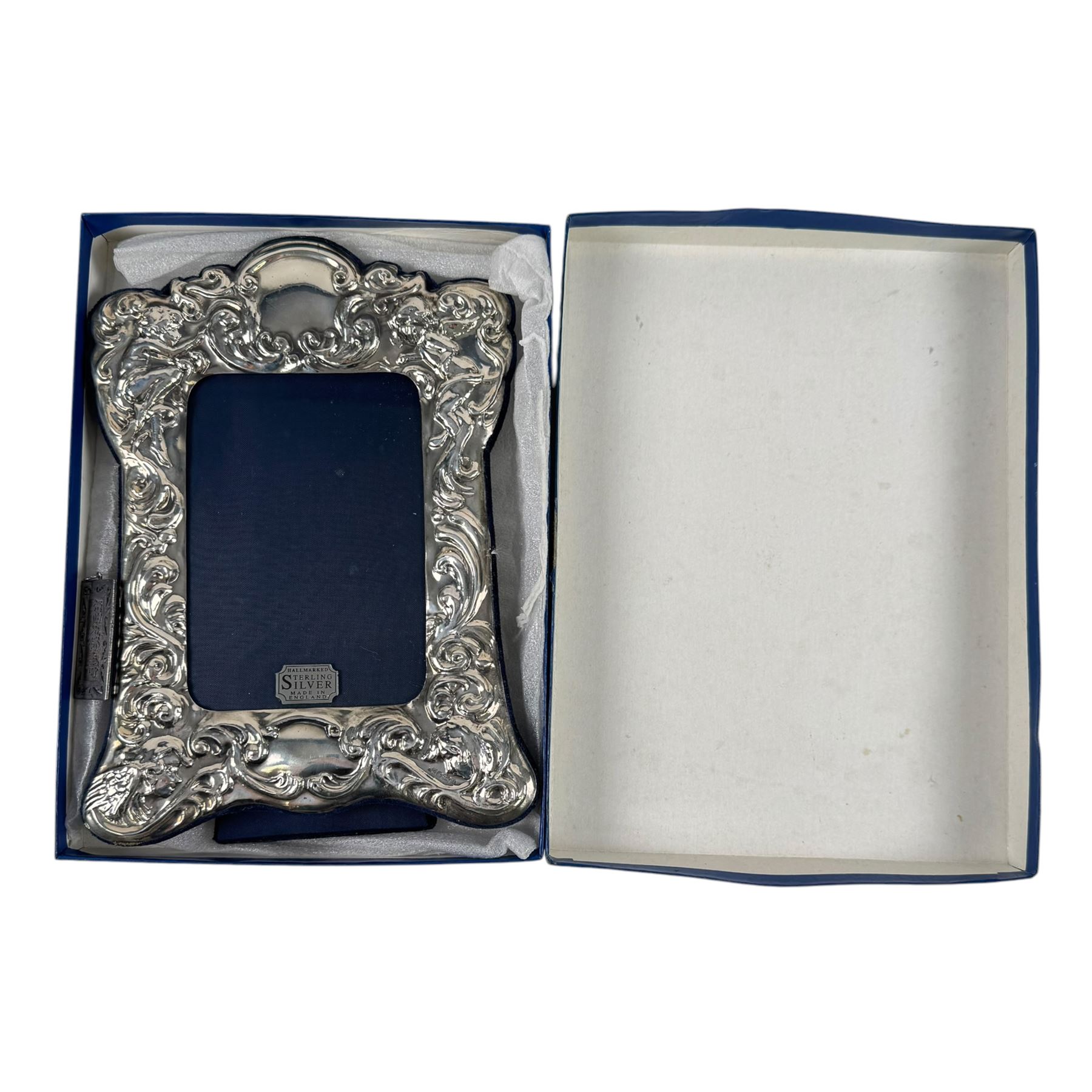 Silver pendant with engraved Fu Lu Shou detail, stamped 925; together with silver mounted photo frame with embossed floral decoration, hallmarked Carr's of Sheffield Ltd 199, H22cm