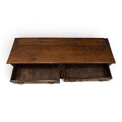 George III oak dresser base, rectangular top with moulded edge, fitted with two drawers over shaped spandrels, raised on square chamfered supports united by undertier, on stile feet