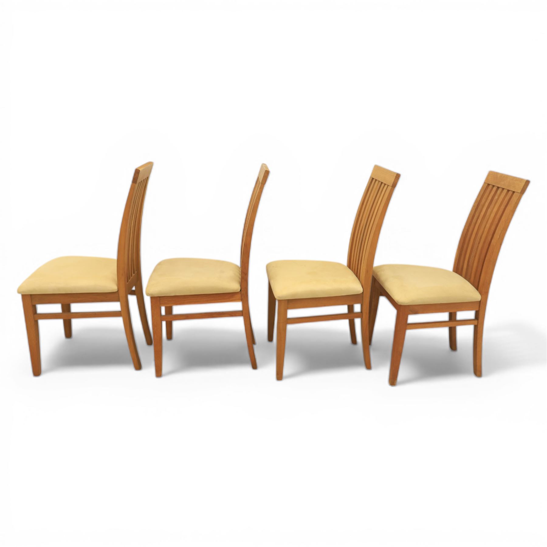 Contemporary teak dining suite comprising extending table and eight chairs, the table with rectangular plank top and one additional leaf extending to 210cm, supported on square tapering legs, the chairs with tall slatted backs and cream upholstered seats