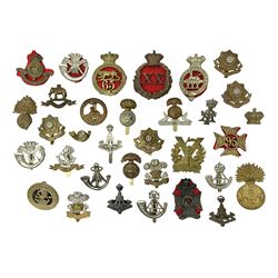 Over thirty regimental cap badges for fu