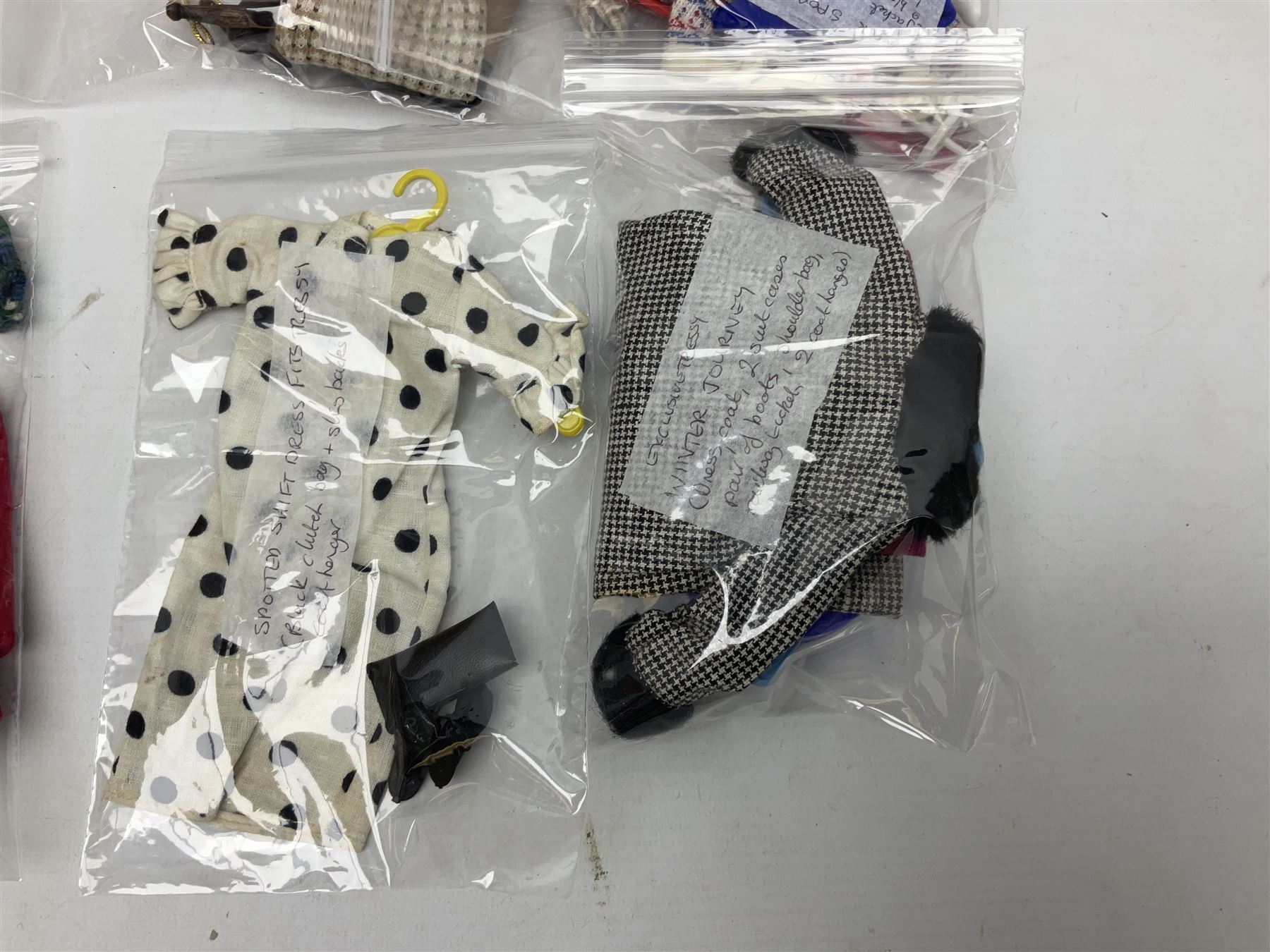 1960s Palitoy Tressy fashion doll, boxed with stand and booklets; four additional Tressy outfits (In The Office, Winter Journey, Winter Sports and Evening Date); two other outfits; and Tressy's Little Sister Toots doll with Style Book and additional outfit