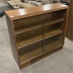 Mid-20th century oak library bookcase, sloped form and fitted with two sliding glass doors - THIS LOT IS TO BE COLLECTED BY APPOINTMENT FROM THE OLD BUFFER DEPOT, MELBOURNE PLACE, SOWERBY, THIRSK, YO7 1QY