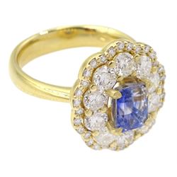 18ct gold radiant cut Ceylon sapphire and round brilliant cut diamond cluster ring, hallmarked, sapphire approx 1.20 carat, total diamond weight approx 1.40 carat