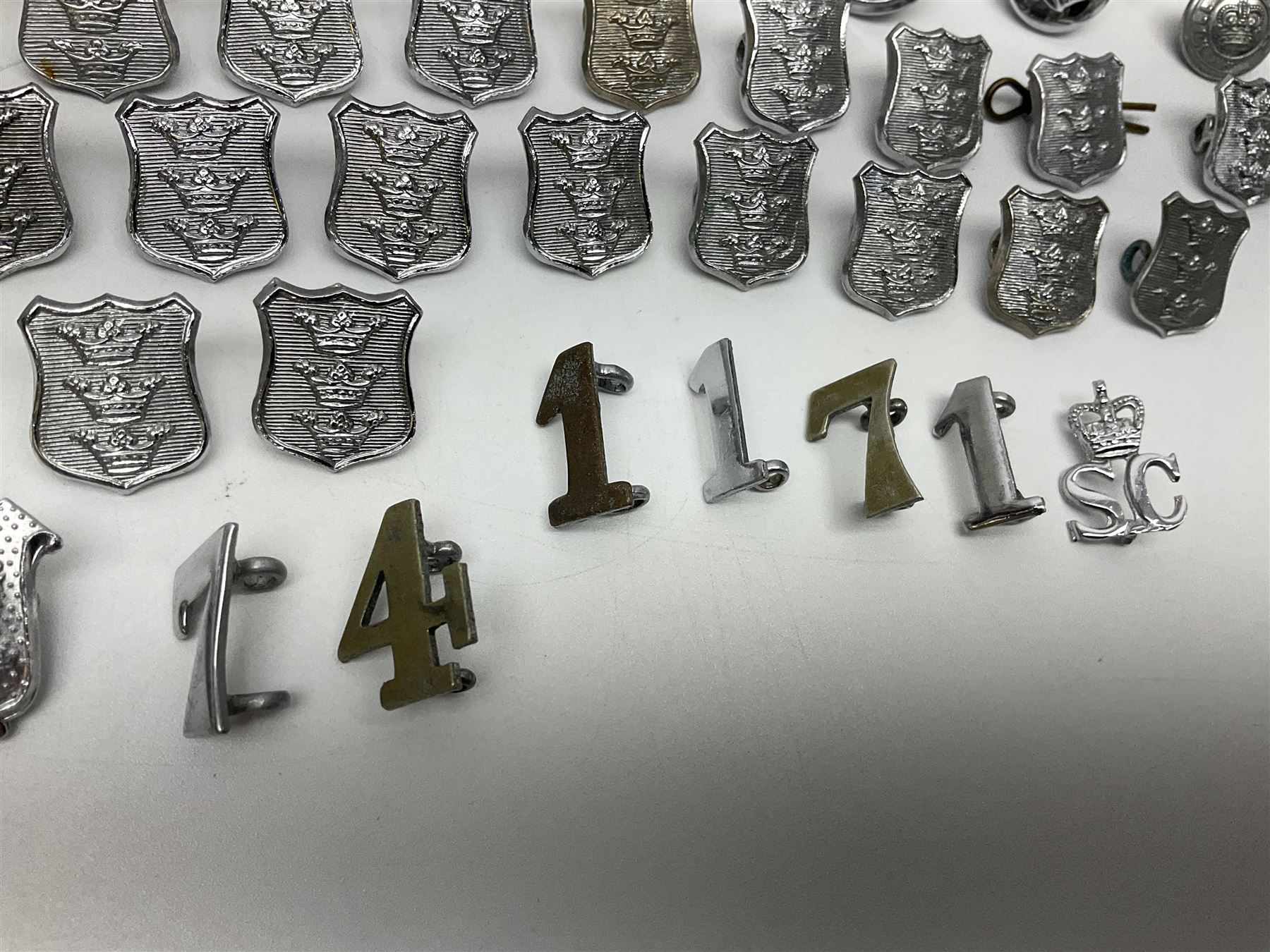 Police - large quantity of cap and collar badges, collar numbers and buttons for Hull City Police, Humberside Police, Lincolnshire Constabulary, York & North East Yorks Police etc; all queen's crown; and three helmet plates including one king's crown