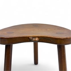 Mouseman - oak three-legged cow stool, kidney-shaped seat carved with the signature mouse motif, by the workshop of Robert Thompson, Kilburn