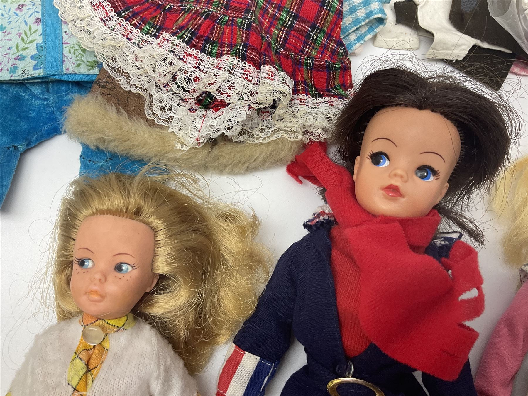 Six fashion dolls by Amanda Jane, Sindy and Barbie with various outfits, clothing and footwear