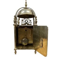 English - 20th century 8-day lantern clock in period 18th century style, square brass case surmounted by a domed bell, with a brass chapter, engraved dial centre and stylised period steel hands, with a two train spring driven movement striking the hours and half hours on a bell. With pendulum. 