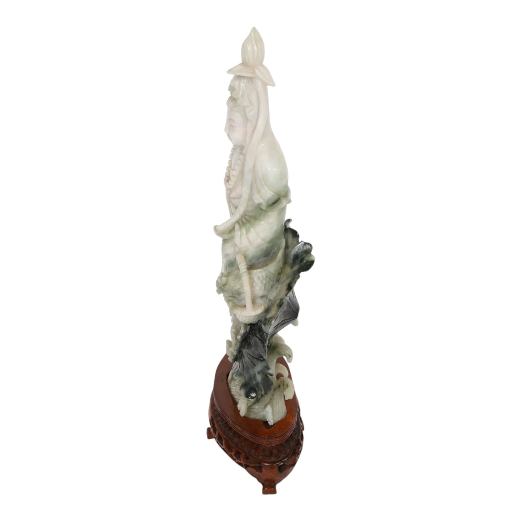 Chinese carved hardstone figure of Guanyin on wooden base, H31cm