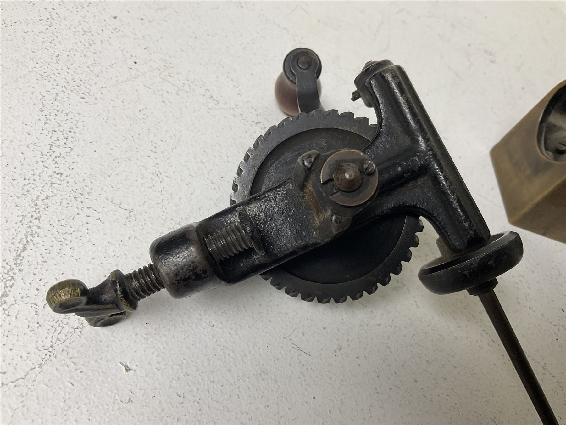 Cambridge Scientific Instruments Co clinometer, flintlock tinder lighter, and a Anders Mattson Mora patent bobbin winder (3)