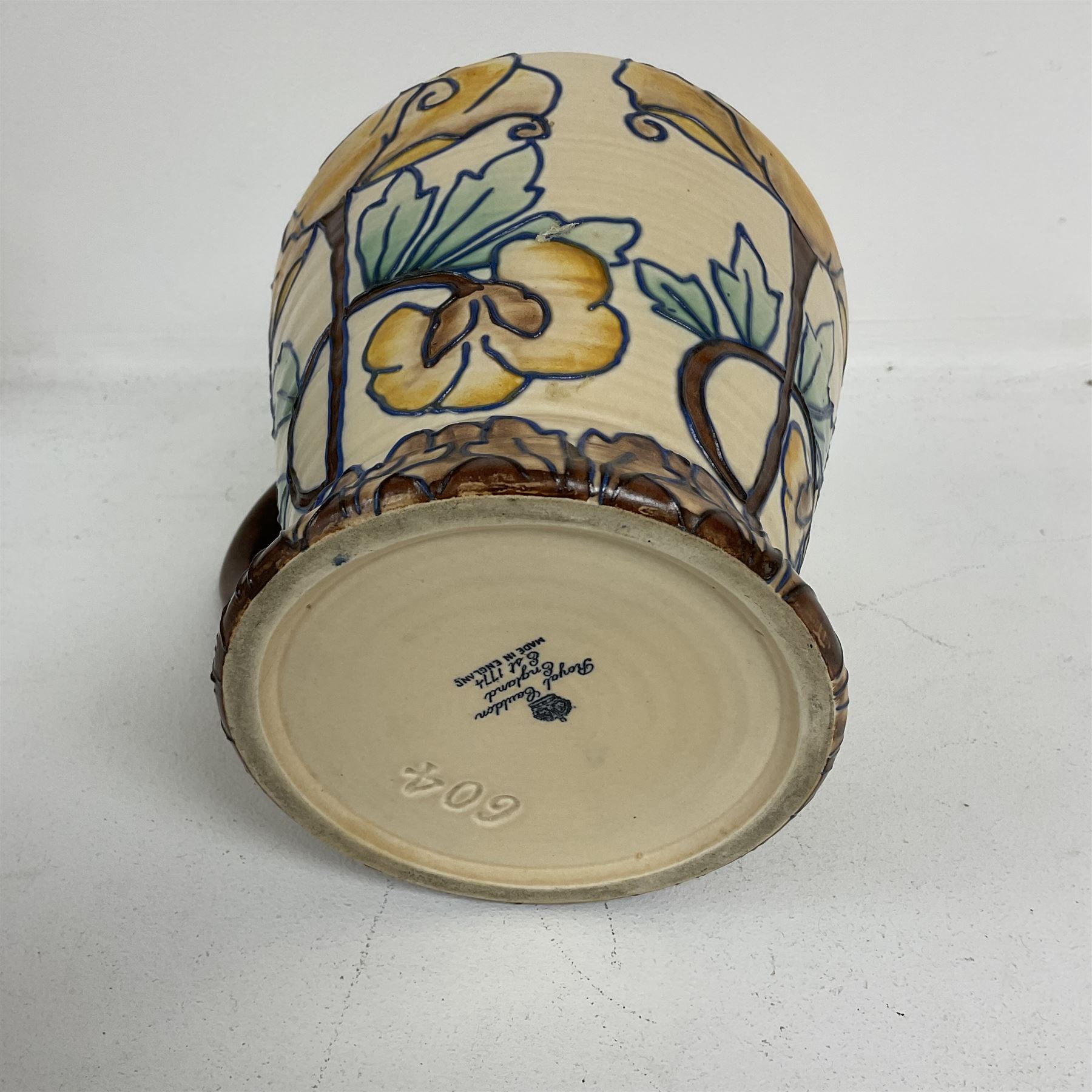 Royal Cauldon single handled vase of tapering form tube lined with a floral pattern by Edith Gater H17cm