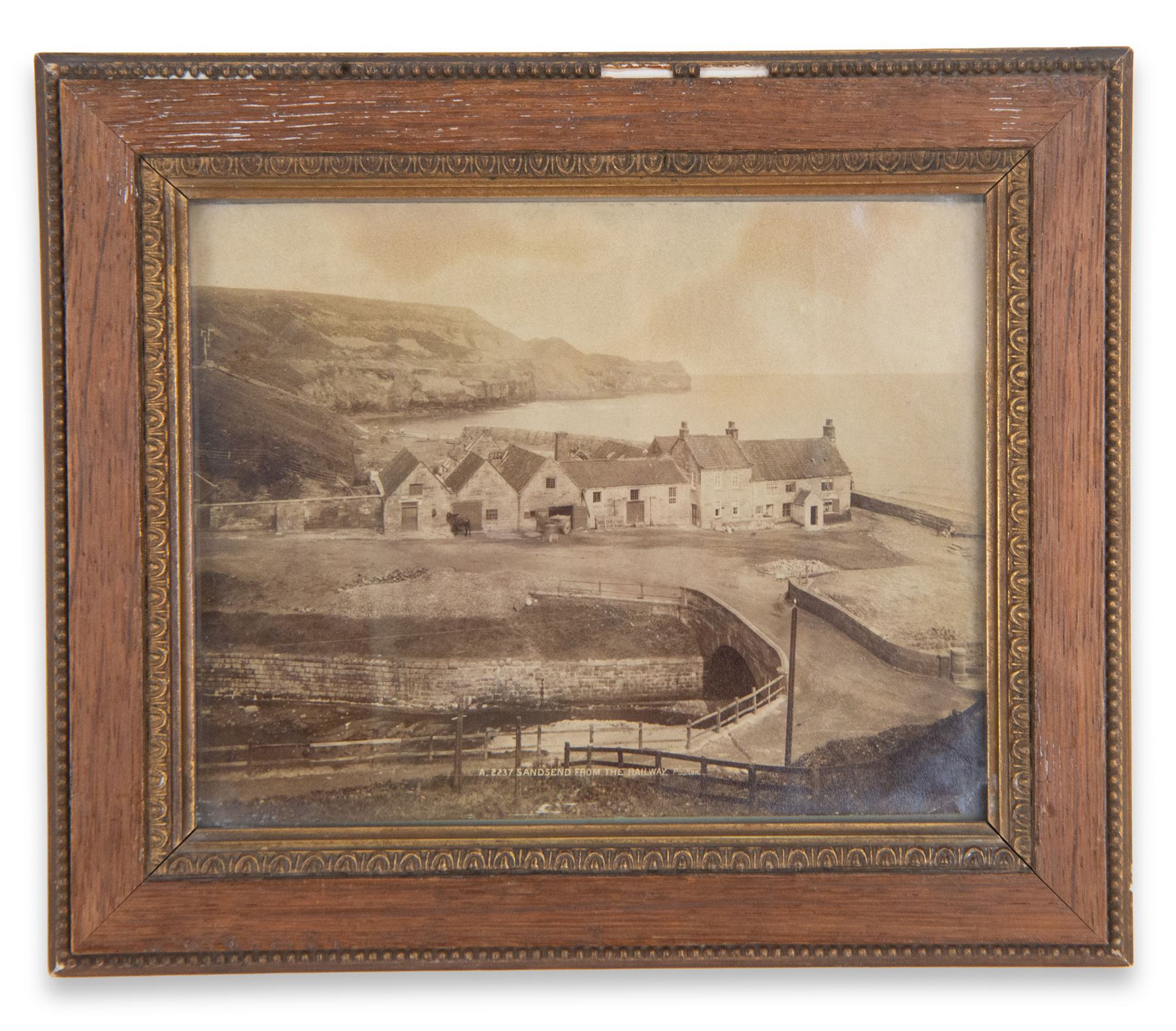 After Frank Meadow Sutcliffe (British 1853-1941): 'Pier Road Whitby', photographic print with facsimile signature 34cm x 44cm; 'Sandsend from the Railway', 19th/early 20th century photograph pub. Poulton No.A.2237, 14cm x 18cm (2) 