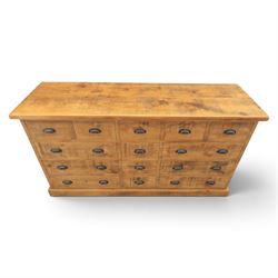 Indigo Furniture - large rustic oak combination chest sideboard, fourteen drawer with blackened metal cup handles, on a plinth base