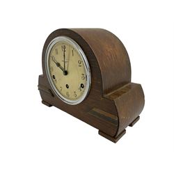 Westminster chiming mantle clock in an oak cases