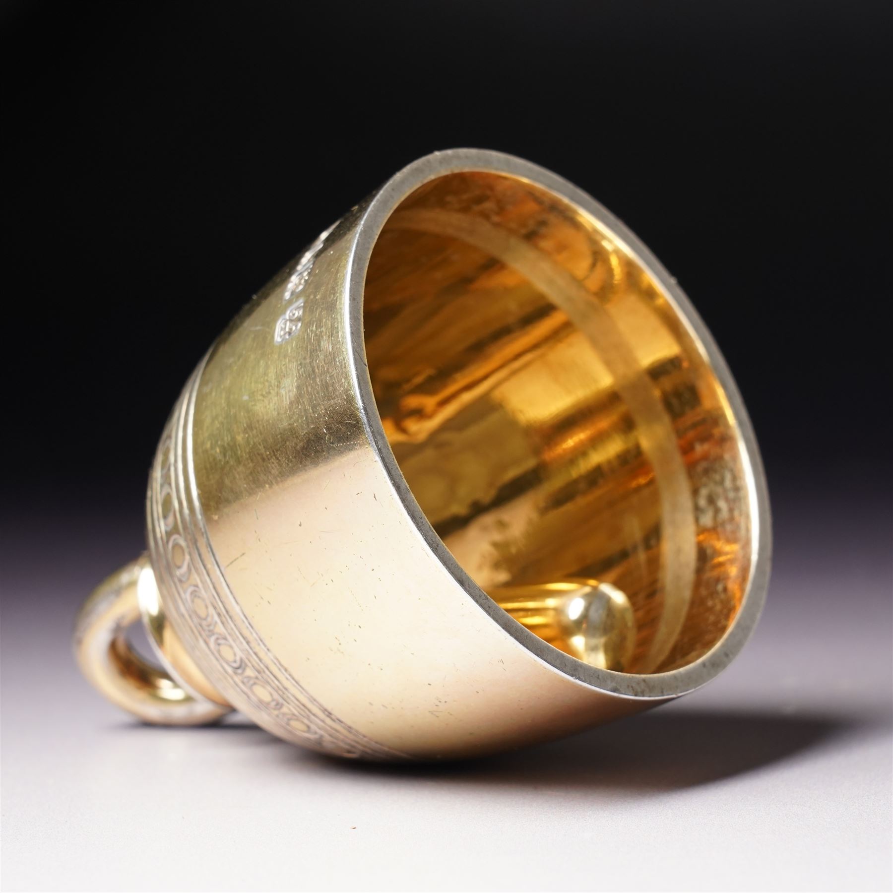 Late Victorian silver gilt table bell with reeded and roundel decoration and loop handle, bell and clapper both hallmarked H7cm London 1900 Maker R & S Garrard & Co