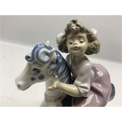 Three Lladro figures, comprising Faithful Steed no 5769, My Goodness no 1285 and Little Girl with Slippers no 4523, two with original boxes, largest example H22cm