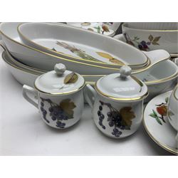Royal Worcester Evesham pattern, including covered pot de cremes, twin handle tureen, serving dishes, flan dishes, side plates etc  