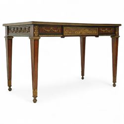 Fine 19th-century Louis XVI-style mahogany and gilt bronze-mounted writing table, rectangular top with a gilt tooled tan leather writing surface within a moulded gilt bronze edge above a frieze fitted with three drawers, mounted with floral and foliate gilt bronze swags  and borders, raised on square tapering legs with acanthus mounts and toupie feet