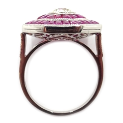  Old cut diamond and calibre cut ruby octagonal platinum (teste) target ring, with diamond set shoulders  