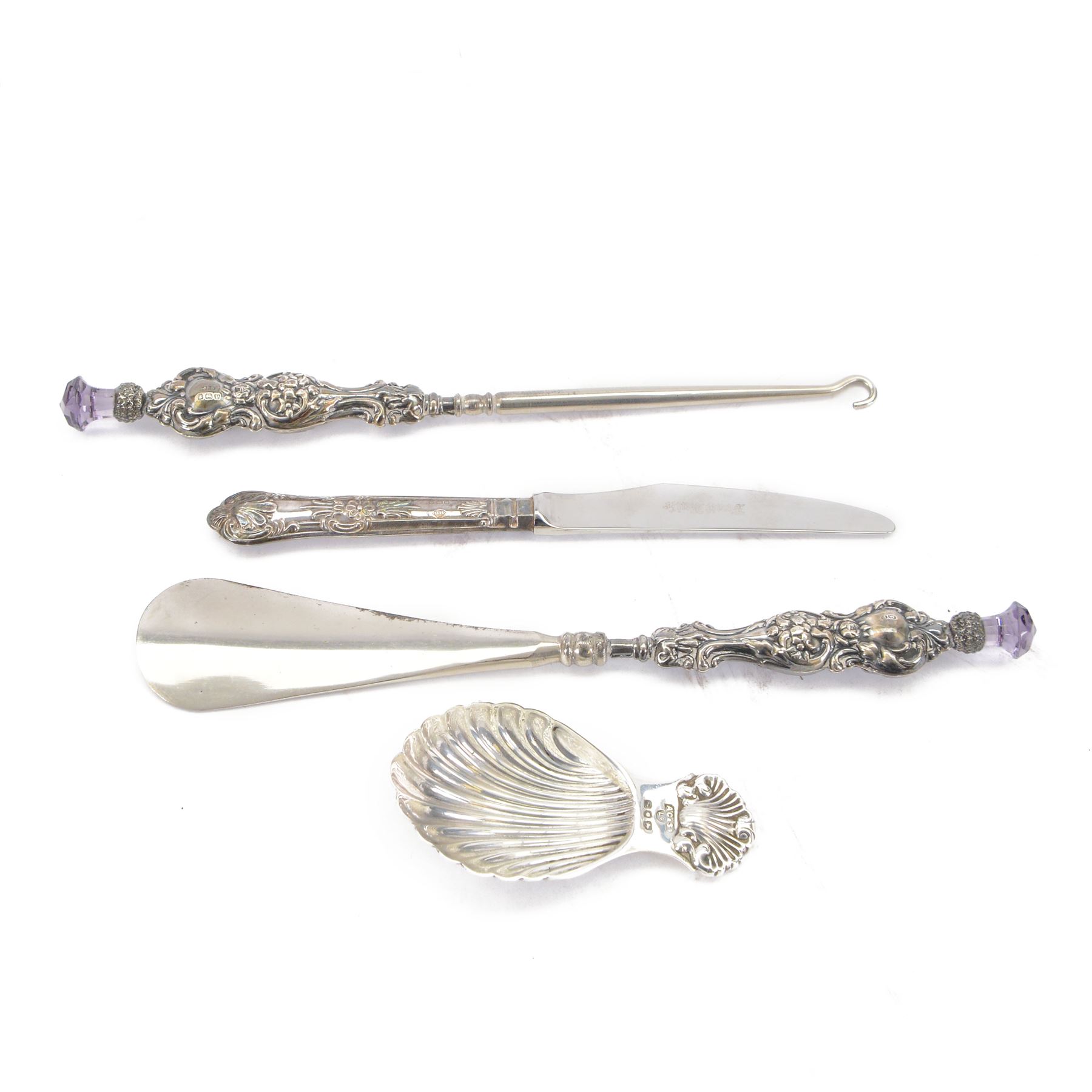Mid 20th century silver caddy spoon, with palmette bowl and handle, hallmarked A Chick & Sons Ltd, London 1966, together with an early 20th century silver handled shoe horn and button hook and a a silver handled knife, all hallmarked 