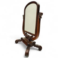 Ornate Victorian mahogany dressing table mirror, of rectangular form with rounded corners, mounted within a carved wooden frame with elaborate foliate scrolled supports, on scrolled feet 