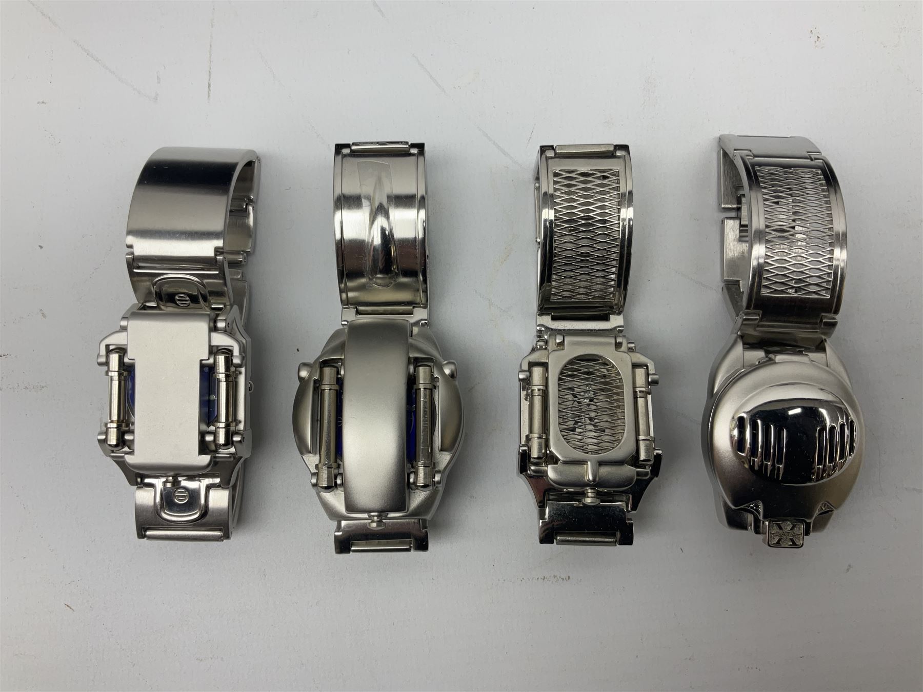 Four X Data stainless steel wristwatches, two Marc Gay wristwatches and one other, all with cover plates