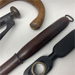 Two late 19th century fruit picker canes, the first example a French ebonised bamboo cane, with pair of fruit scissors to base, the handle stamped Cueille Fruit, the second example with grabbing action, the cap stamped A C Harris, Leicester, together with two other 19th century canes, one with fork and the other with hoe