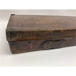 Leather shotgun case, the red baize lined interior with the trade labels of Westley Richards & Co., London, a brass plaque inscribed 'T Nevin, Mirfield, Yorkshire' to cover, with key, case to fit barrel 76cm (30 inches)  
