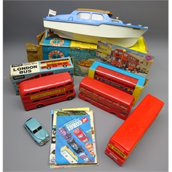  Scalex Boats battery operated Derwent Cabin Cruiser, boxed, two boxed and two loose plastic models of London buses, clockwork die-cast saloon car reg.no.MTY02, probably Mettoy, and seven 1960's and later die-cast toy catalogues for Dinky (3), Corgi (2), Spot-On and Britains (13)  