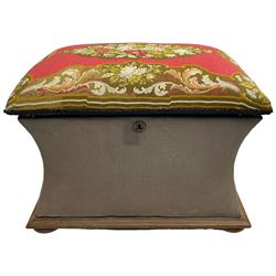 19th century upholstered ottoman, rectangular waisted form with hinged lid, upholstered in needle work cover decorated with floral panels and borders, the interior lined in blue fabric, lower moulded edge over compressed bun feet