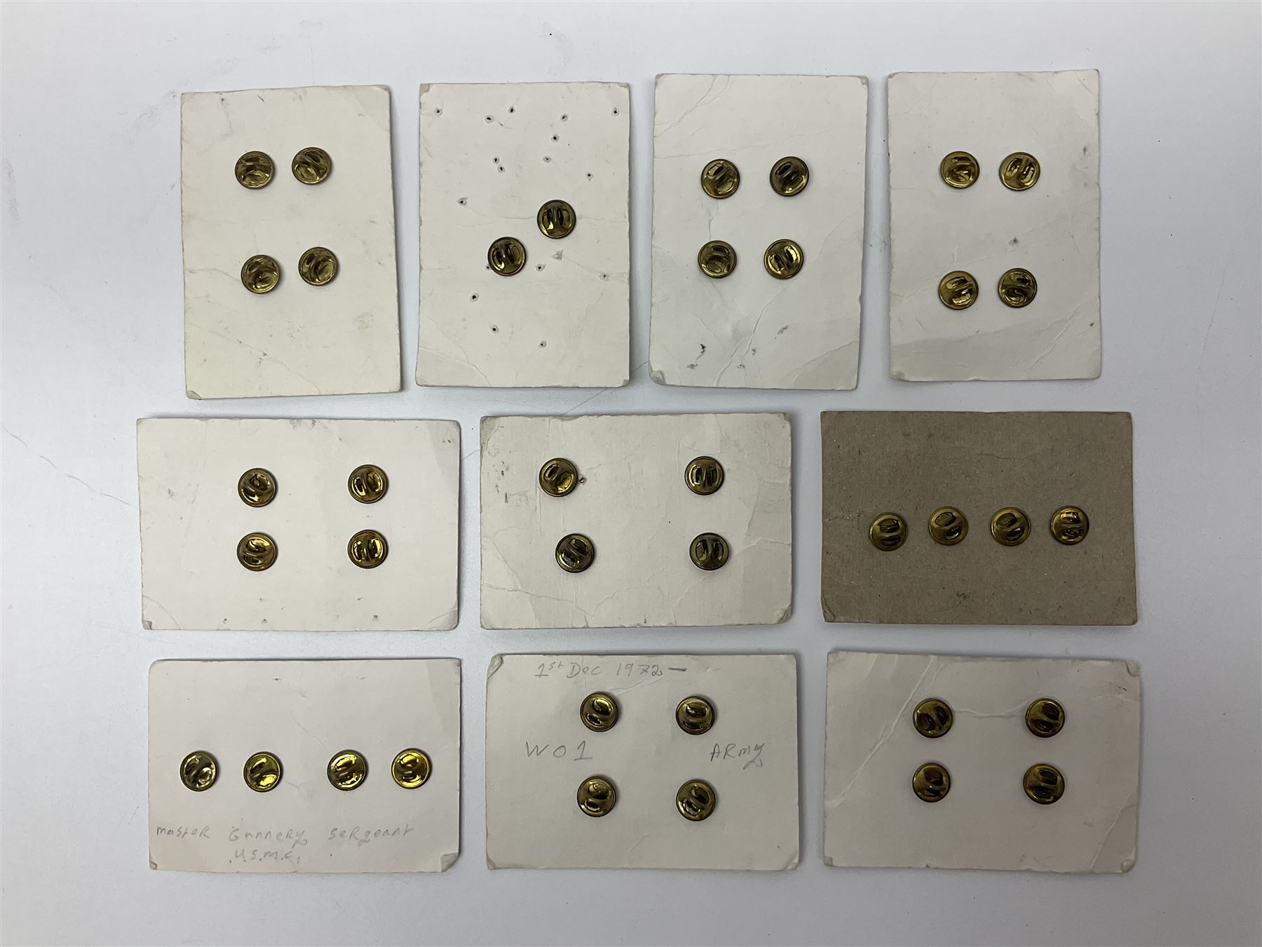 Fifty US rank badges and trade badges; WW2 and Vietnam period; predominantly on sale cards