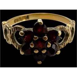 Four 9ct gold stone set rings, including garnet and pearl examples, all stamped or hallmarked