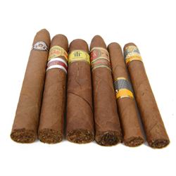 Collection of cigars, including Montecristo, Cohiba, Diplmaticos, and other cigars, within a Montecristo humidor