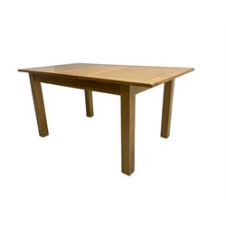 Light oak extending dining table, rectangular top with rounded corners raised on square supports, with additional leaf