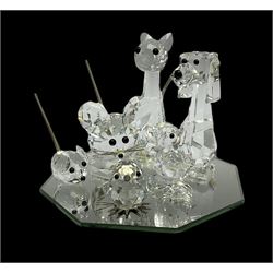 Swarovski crystal cat, dog, two mice and two chicks on display mirror