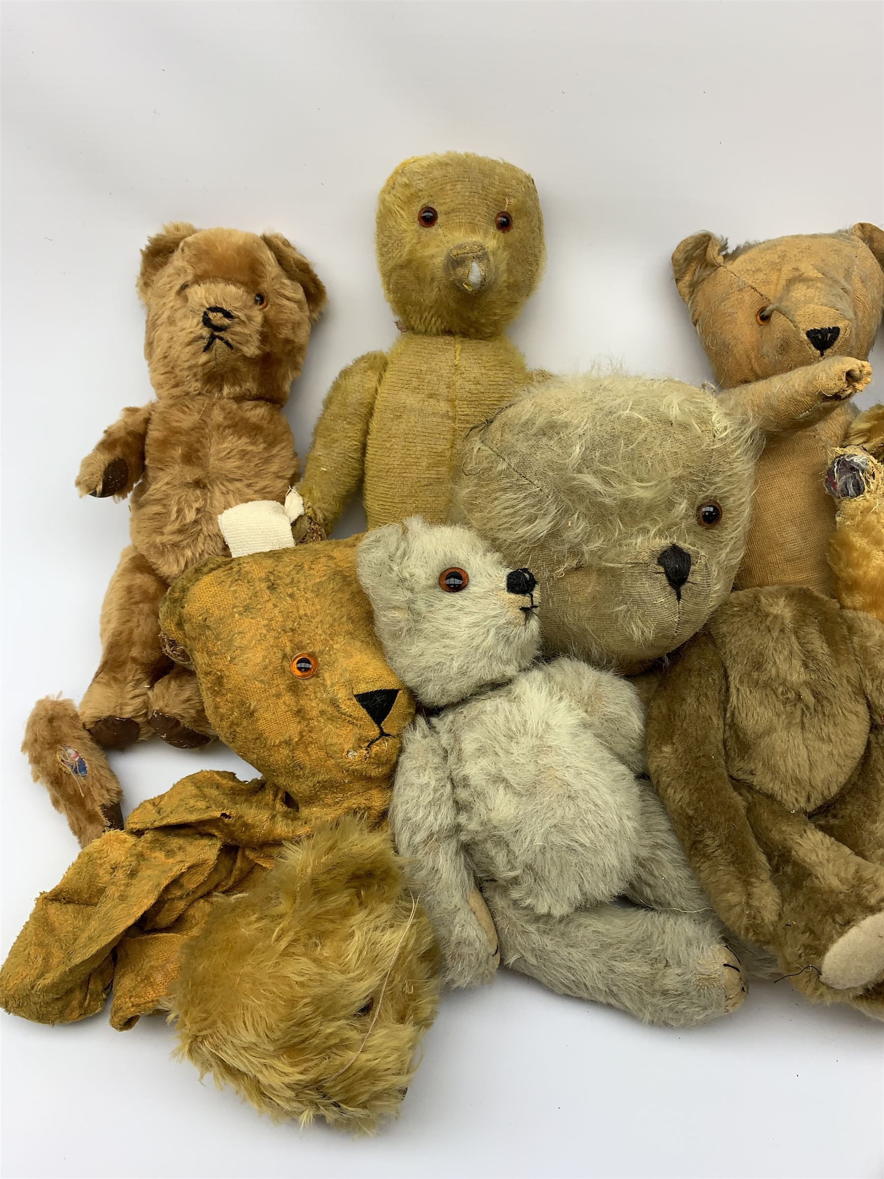 Quantity of early wood wool filled teddy bears for restoration.