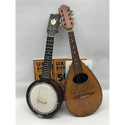 W.D. Keech banjolele pat.219720/23 with etched signature to the back; serial no.A12082 L55cm; and a restored Italian mandolin with segmented lute back; together with three music books
