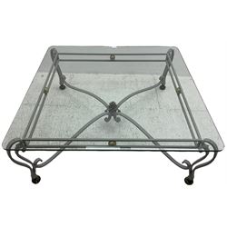 Wrought metal and glass top coffee table, square glass top on scrolled supports with brass feet, scrolled stretchers with pineapple finial 