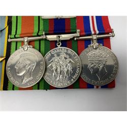 Group of five medals comprising 1939-1945 War Medal, Defence Medal, 1939-1945 Star, Air Crew Europe Star and Canadian Volunteer Service Medal with maple leaf clasp; all with ribbons and mounted on a display board