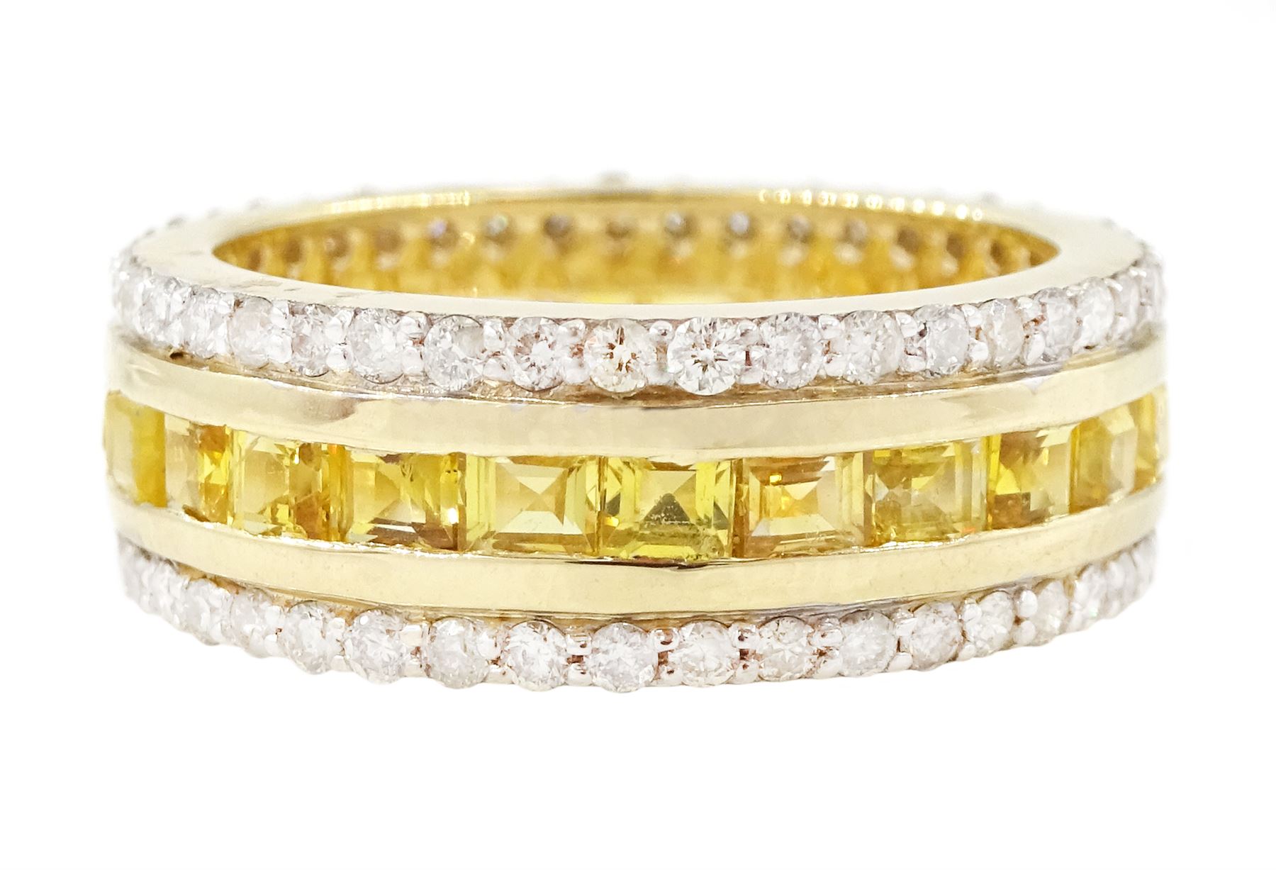 Gold yellow sapphire and diamond three row full eternity ring, channel set calibre cut sapphires, with a row of round brilliant cut diamonds set either side, stamped 9K, total sapphire weight approx 2.95 carat, total diamond weight 0.85 carat