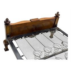 Mid-20th century walnut single bedstead, high shaped headboard, footboard with turned finials and scrollwork carvings, complete with 'Vono' iron frame, raised on cabriole supports
