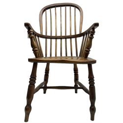 Early 19th century elm Windsor chair, high hoop and stick back over shaped saddle seat, raised on ring turned supports united by H-stretcher