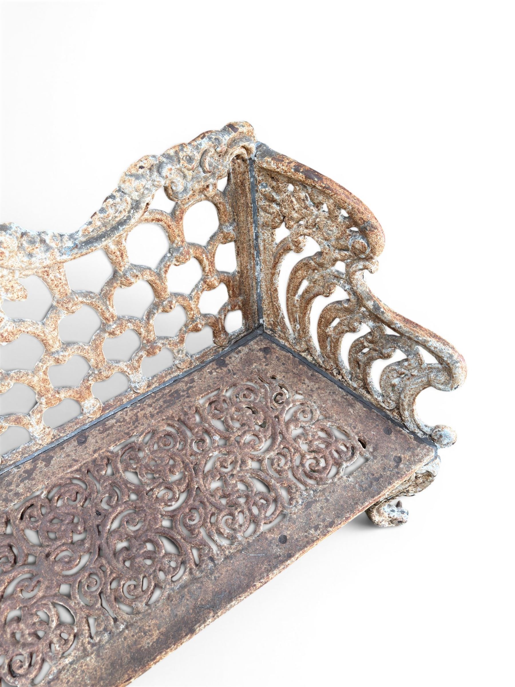 Victorian revival Carron Foundry design heavy cast iron two seat garden bench, scrolled arms with pierced lattice seat, finished in antique white paint