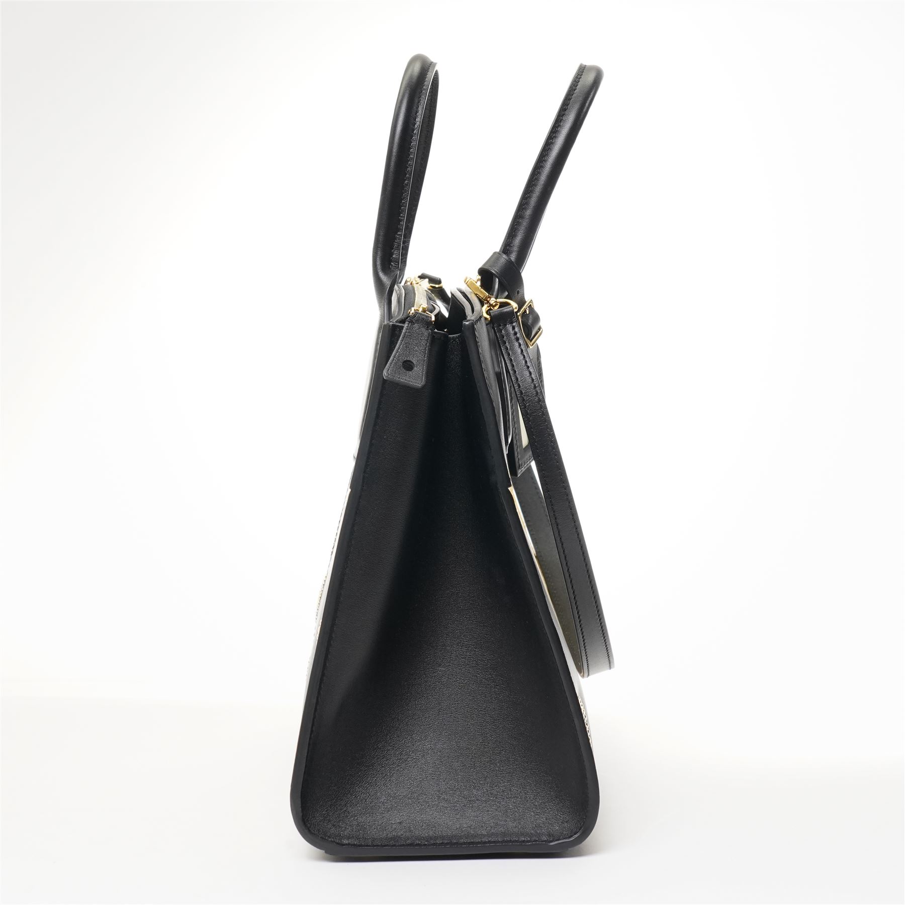 Louis Vuitton - ‘City Steamer MM’ 'Night Lights' Limited Edition Tote Bag, the model introduced for the Cruise 2016 collection under Nicolas Ghesquière, this example from the Spring/Summer 2017 collection, in black leather with Monogram canvas and contrasting pale gilt leather panels, applied with studded embellishments, with twin top handles and detachable shoulder strap, unused with padlock and luggage tag, original box and dust bag