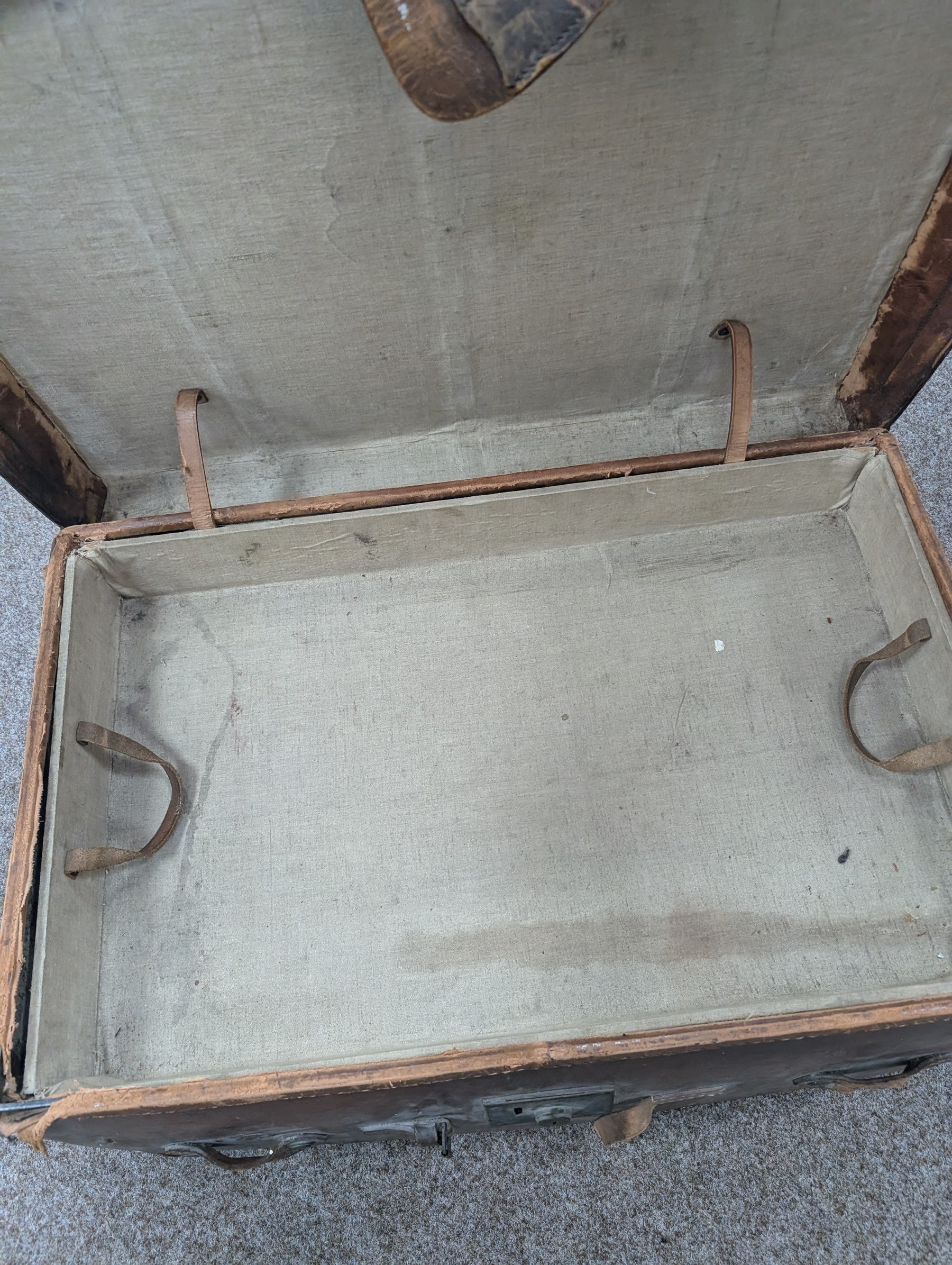 Large leather travelling trunk, together with a vintage suitcase