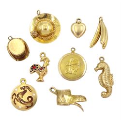  Four 18ct gold gold pendant / charms including cockrill, bunch of bananas, hat and Capricorn, four 9ct gold charms including old boot, seahorse and hat and a 14ct gold heart charm