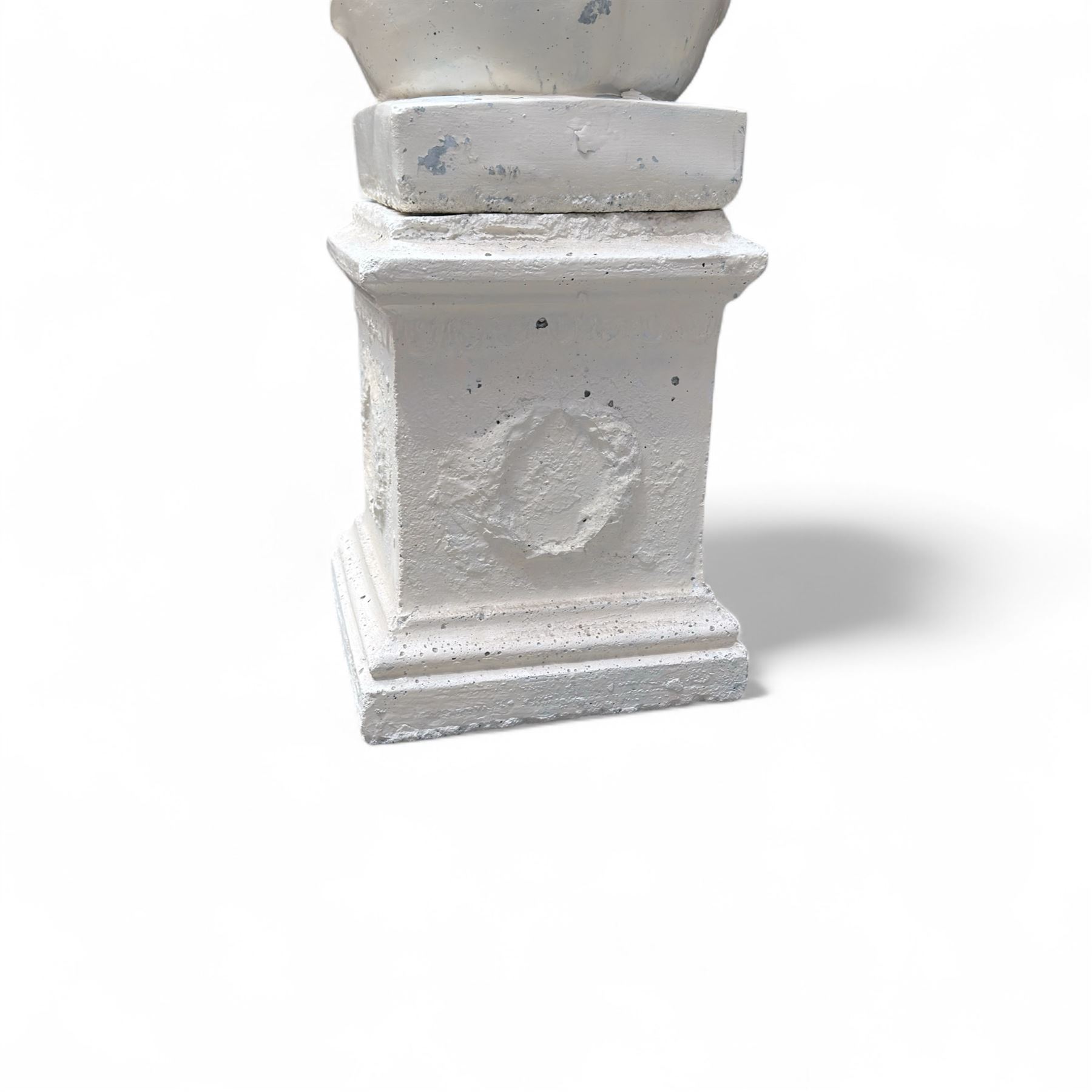 Cast stone garden statue, painted in a white finish on plinth