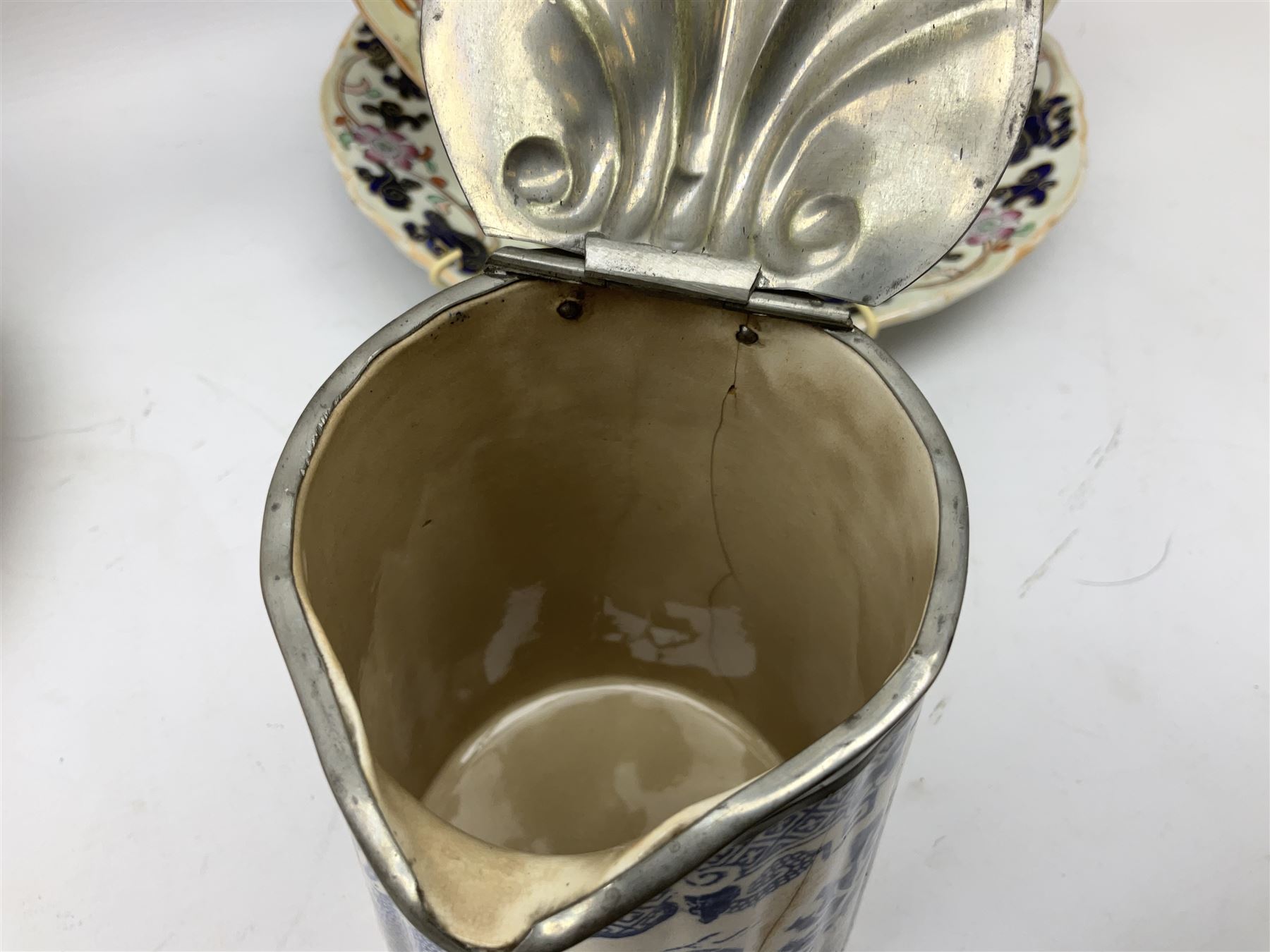 Four mid 19th century Mason's Ironstone plates decorated in the Chinese Antiquities pattern, the central circular panel decorated with footed vase with stylised motifs within a floral border, with gilt detail, pattern no. 1438, largest D26cm, together with Royal Worcester plate with floral decoration within green borders, blue and white tankard with pewter lid and teapot, teapot
